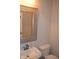 Half bathroom featuring stylish framed mirror, white vanity and toilet at 10166 Ranford Blvd, Fishers, IN 46040