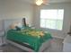 Bedroom featuring ceiling fan, window, and neutral decor at 10166 Ranford Blvd, Fishers, IN 46040