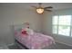 Bedroom featuring ceiling fan, window, and neutral decor at 10166 Ranford Blvd, Fishers, IN 46040