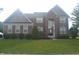Charming brick two-story home featuring manicured lawn and traditional architectural details at 10166 Ranford Blvd, Fishers, IN 46040