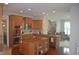 Spacious kitchen with stainless steel appliances, wooden cabinets, and a central island at 10166 Ranford Blvd, Fishers, IN 46040