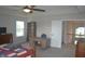 Spacious main bedroom features a tray ceiling, ceiling fan, and a study nook at 10166 Ranford Blvd, Fishers, IN 46040