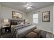 A cozy bedroom featuring a queen-sized bed, soft lighting, and stylish decor at 10246 Liverpool Way, Indianapolis, IN 46236