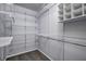 Walk-in closet with white wire shelving and some personal items at 10246 Liverpool Way, Indianapolis, IN 46236