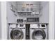 Organized laundry room featuring newer washer and dryer with wire shelving and small appliances on the countertop at 10246 Liverpool Way, Indianapolis, IN 46236