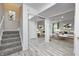 Inviting living room with hardwood floors, a mirror closet and an open floor plan at 10246 Liverpool Way, Indianapolis, IN 46236