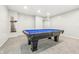 Finished basement showcasing the pool table at 1066 N Dogwood Way, Greenfield, IN 46140