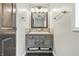 Bathroom featuring vanity with sink, modern fixtures, hardwood floors, and a neutral color palette at 1066 N Dogwood Way, Greenfield, IN 46140