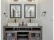 Bathroom featuring double vanity with stone sinks, modern fixtures, and ample counter space at 1066 N Dogwood Way, Greenfield, IN 46140