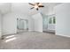 Bedroom featuring neutral carpeting, a window, and mirrored closet doors at 1066 N Dogwood Way, Greenfield, IN 46140