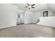 Open bonus room with neutral carpeting, ceiling fan and natural light at 1066 N Dogwood Way, Greenfield, IN 46140