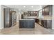 Well-equipped kitchen featuring a central island, stainless steel appliances, ample cabinetry, and sleek countertops at 1066 N Dogwood Way, Greenfield, IN 46140