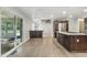 Modern kitchen with granite countertops, sliding glass doors, and stainless steel appliances providing ample storage at 1066 N Dogwood Way, Greenfield, IN 46140