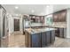 Gourmet kitchen with stainless steel appliances, granite countertops, and a center island with a gas cooktop at 1066 N Dogwood Way, Greenfield, IN 46140