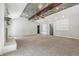 Inviting living room with vaulted ceilings, exposed wood beam and large windows, perfect for relaxing or entertaining at 1066 N Dogwood Way, Greenfield, IN 46140