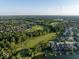 Expansive aerial view of golf course community featuring lush greenery and waterfront properties at 11137 Peppermill Ln, Fishers, IN 46037