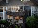 Beautiful backyard with a spacious deck, an outdoor seating area with a fire pit, and lush landscaping at 11137 Peppermill Ln, Fishers, IN 46037