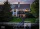 Picturesque backyard with lake access, a private dock, and a beautifully landscaped lawn at 11137 Peppermill Ln, Fishers, IN 46037