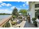 Outdoor deck has a lake view with potted plants and outdoor chairs at 11137 Peppermill Ln, Fishers, IN 46037