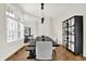 Bright dining room with modern table and chairs, accented by sleek hardwood flooring and window shutters at 11137 Peppermill Ln, Fishers, IN 46037