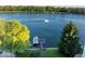 Scenic lake view featuring a private dock, boats, and tranquil waterfront at 11137 Peppermill Ln, Fishers, IN 46037