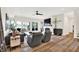 Bright living room featuring a brick fireplace, modern furnishings, and lake views at 11137 Peppermill Ln, Fishers, IN 46037