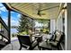 Covered patio with comfortable seating and a beautiful view of the lake at 11137 Peppermill Ln, Fishers, IN 46037