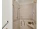 Modern walk-in shower with glass doors, tile surround, and a built-in seat at 11137 Peppermill Ln, Fishers, IN 46037