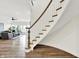 Open staircase leading to a living area with lots of natural light at 11137 Peppermill Ln, Fishers, IN 46037