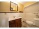 This renovated bathroom features a modern vanity and subway tiled shower at 11218 Exchange St, Indianapolis, IN 46259