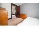 A bedroom with simple decor, wood furnishings and neutral paint at 11218 Exchange St, Indianapolis, IN 46259