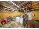 Messy garage with a variety of tools and storage items at 11218 Exchange St, Indianapolis, IN 46259