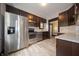 A modern kitchen featuring stainless steel appliances, granite countertops and subway tile backsplash at 11218 Exchange St, Indianapolis, IN 46259