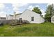 Spacious backyard with a deck, grassy area, and mature trees offering a peaceful retreat at 11620 Glenn Abbey Ln, Indianapolis, IN 46235
