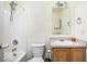 This bathroom includes tub and shower combo with a vanity sink at 11620 Glenn Abbey Ln, Indianapolis, IN 46235