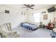 This cozy bedroom is adorned with light-filled space and whimsical decor at 11620 Glenn Abbey Ln, Indianapolis, IN 46235