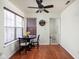 Bright dining area features hardwood floors, a round table, and natural light from a large window at 11620 Glenn Abbey Ln, Indianapolis, IN 46235