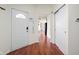 Bright entryway with hardwood floors, closet, and a glimpse into the spacious living area at 11620 Glenn Abbey Ln, Indianapolis, IN 46235