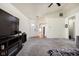 The expansive living room features a cozy carpet and entry to other rooms at 11620 Glenn Abbey Ln, Indianapolis, IN 46235