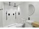 Modern bathroom with a sleek glass-enclosed shower, a minimalist sink, and contemporary black fixtures at 1324 E 9Th, Indianapolis, IN 46202