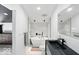 Bright bathroom with a soaking tub, sleek vanity, and modern tiled shower at 1324 E 9Th, Indianapolis, IN 46202