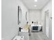 Bright bathroom with double sinks, a soaking tub, and modern fixtures, offering a spa-like atmosphere at 1324 E 9Th, Indianapolis, IN 46202