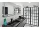 Elegant bathroom with double sink vanity and sleek glass-enclosed shower at 1324 E 9Th, Indianapolis, IN 46202