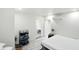 Serene bedroom with white walls, featuring an open en-suite bathroom and modern minimalist decor at 1324 E 9Th, Indianapolis, IN 46202