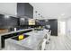 Modern kitchen with an island and black cabinetry, offering ample counter space and contemporary style at 1324 E 9Th, Indianapolis, IN 46202