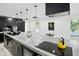 Spacious kitchen features an island with cooktop, modern lighting, and ample storage at 1324 E 9Th, Indianapolis, IN 46202