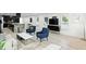 Open-concept living space with modern furnishings and an open flow to the kitchen, creating a bright and inviting atmosphere at 1324 E 9Th, Indianapolis, IN 46202