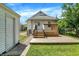 Enjoy the outdoors with a charming wooden deck and stairs, leading to the backyard and detached garage at 1411 N Linwood Ave, Indianapolis, IN 46201
