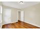 Bedroom featuring refinished hardwood floors and neutral wall paint at 1411 N Linwood Ave, Indianapolis, IN 46201