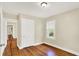 Bedroom with wood floors, one window, closet and neutral walls at 1411 N Linwood Ave, Indianapolis, IN 46201
